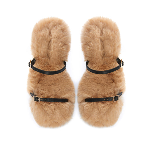 Luxury statement sandals with plush faux fur, black leather straps, and hourglass heel
