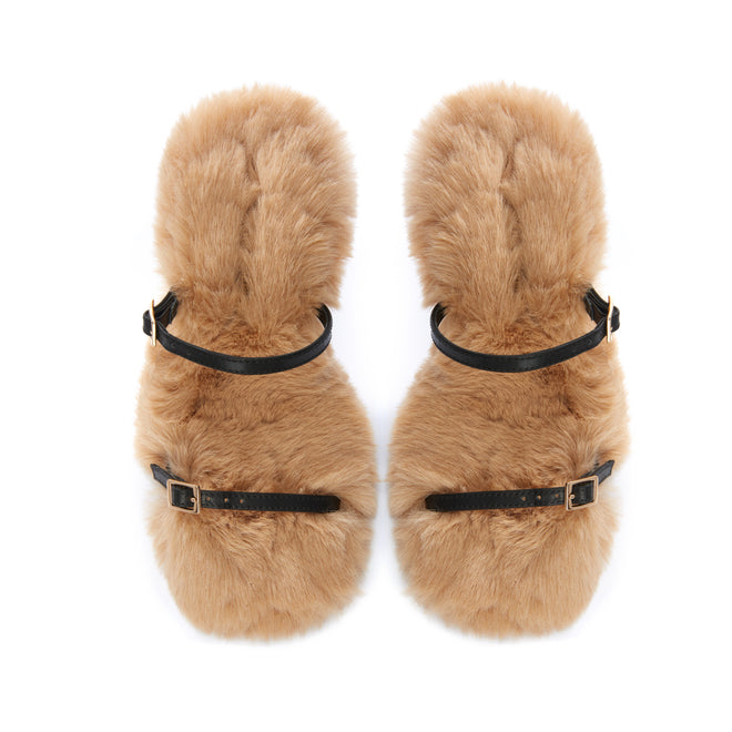 Luxury statement sandals with plush faux fur, black leather straps, and hourglass heel
